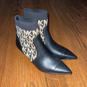 Michael Kors Shiloh Stretched logo leather boots.